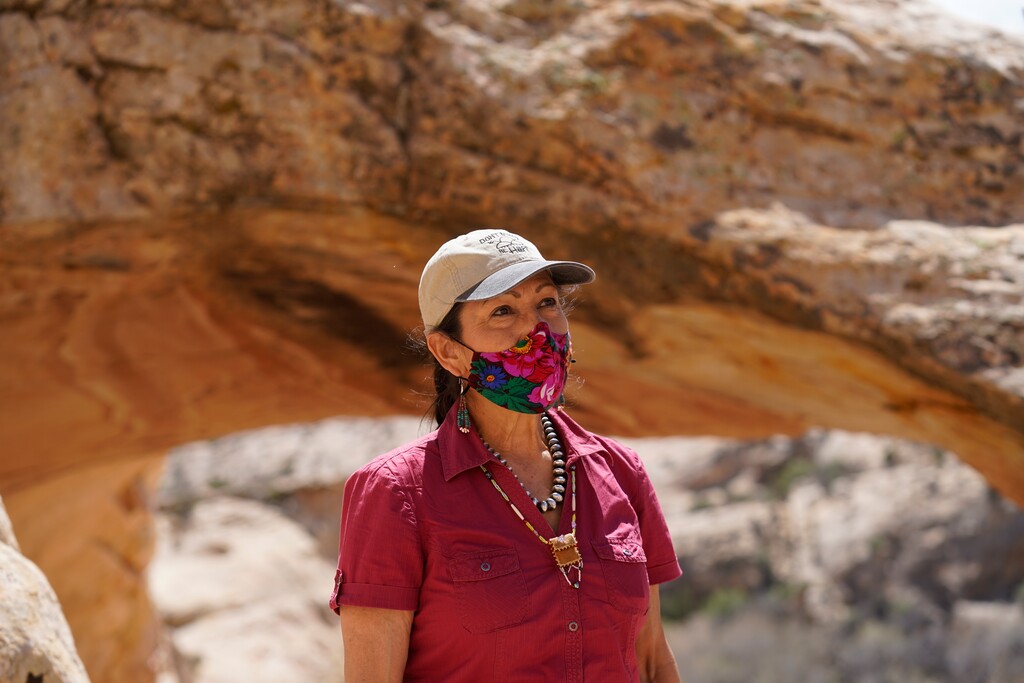(Rick Bowmer | AP, pool) U.S. Interior Secretary Deb Haaland tours near ancient dwellings along the Butler Wash trail during a visit to Bears Ears National Monument Thursday, April 8, 2021, near Blanding.