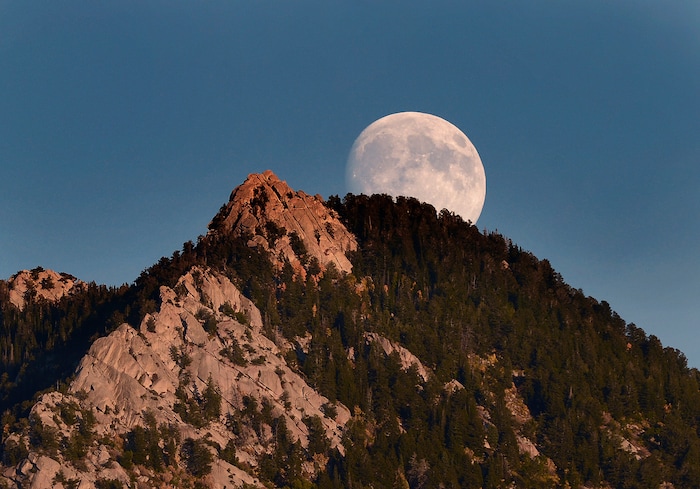 (Scott Sommerdorf  |  The Salt Lake Tribune)  The nearly full moon rises just ahead of kickoff at Brighton. Jordan led Brighton 34-21 at the half at Brighton Friday, September 25, 2015. A total lunar eclipse of a Supermoon will begin on the evening of September 27th.