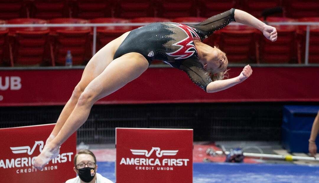 (Rick Egan | The Salt Lake Tribune)   Abby Paulson dismounts from the beam, in PAC-12 gymnastics action between The University of Washington and The University of Utah at Jon M. Huntsman Center in Salt Lake City, on Saturday, Jan. 30, 2021.