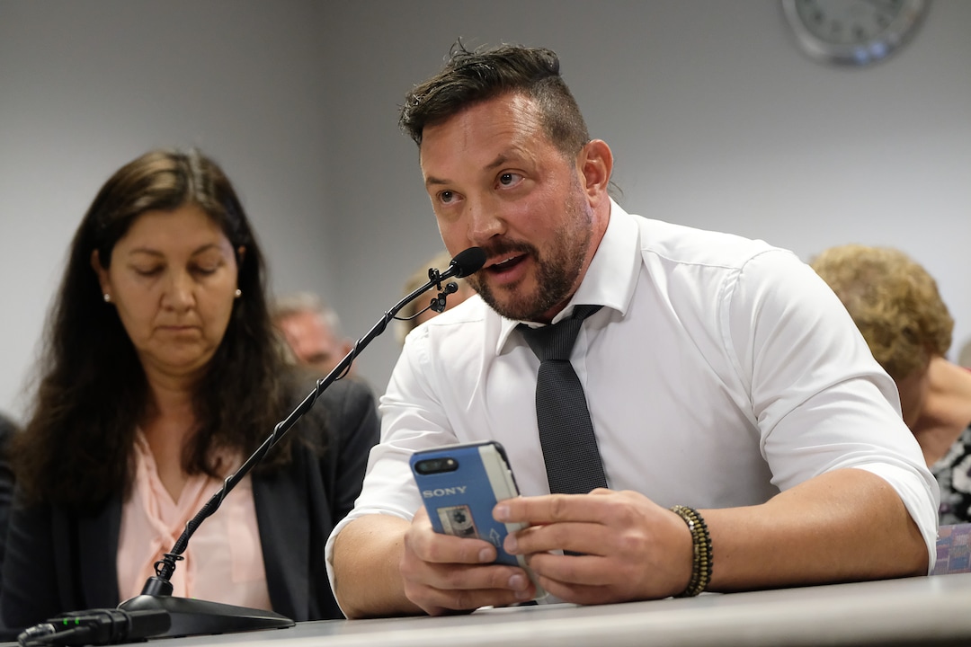 (Francisco Kjolseth  |  The Salt Lake Tribune)  Justin Utley who considers himself a two year conversion therapy survivor speaks in support of a proposed ban on conversion therapy as he attends the public hearing before state regulators in Salt Lake City on Thursday, Sept. 26, 2019.