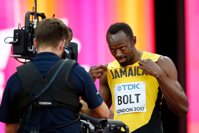 Jamaica's Usain Bolt gestures to a camera as he prepares before a men's 100m semifinal during the World Athletics Championships in London Saturday, Aug. 5, 2017. (AP Photo/Matthias Schrader)