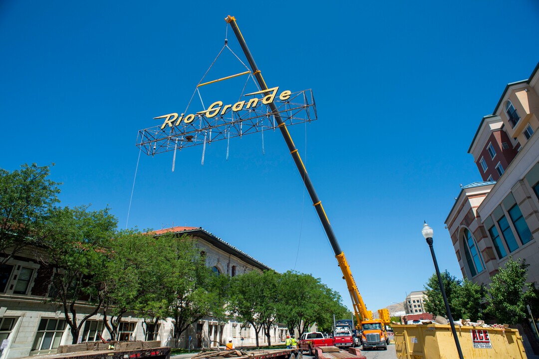 (Rick Egan  |  The Salt Lake Tribune)     The  neon Rio Grande sign that has shined from the rooftop of the Rio Grande Depot for more than 50 years is removed from the building, Monday, Aug. 12, 2019.