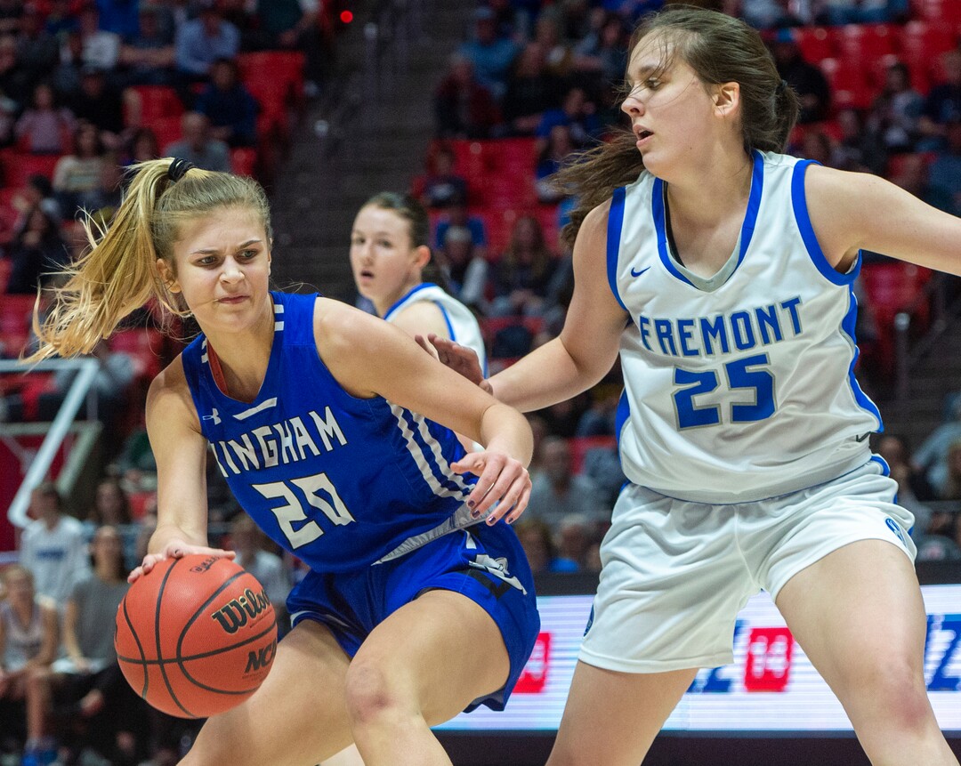 (Rick Egan  |  The Salt Lake Tribune)   Bingham Miners Sierra Lichtie (20) gets past Fremont Sliverwolves Emma Calvert 25, in the 6A championship game, between the Fremont Sliverwolves and the Bingham Miners, at the Jon M. Huntsman Center, Saturday Feb. 29, 2020