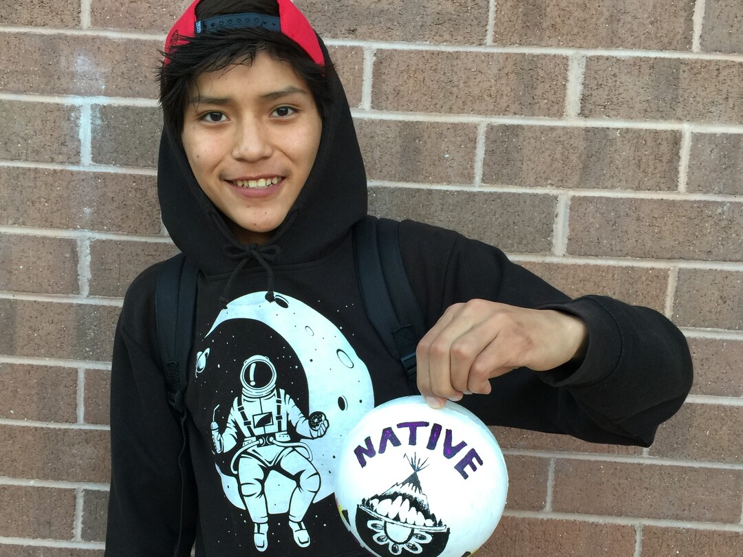 (Photo courtesy of Georgiana Simpson) A student at Whitehorse High School holds an ornament he painted.
