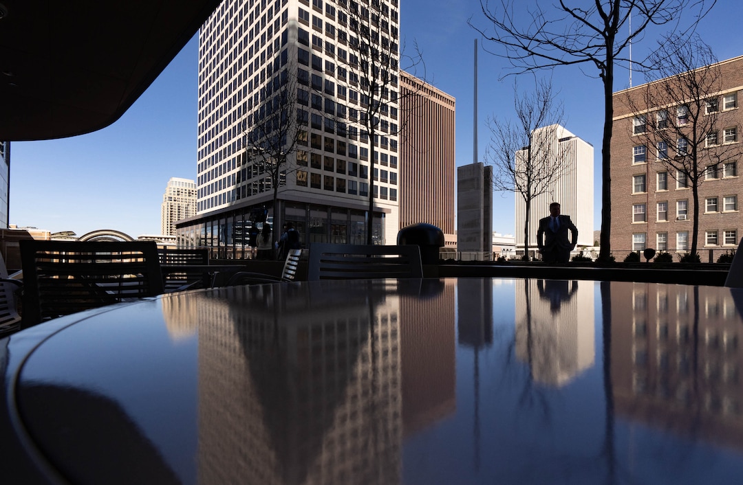 (Francisco Kjolseth | The Salt Lake Tribune) Downtown Salt Lake City is reflected on the terrace of the new 95 State meetinghouse of The Church of Jesus Christ of Latter-day Saints on Friday, April 8, 2022. 