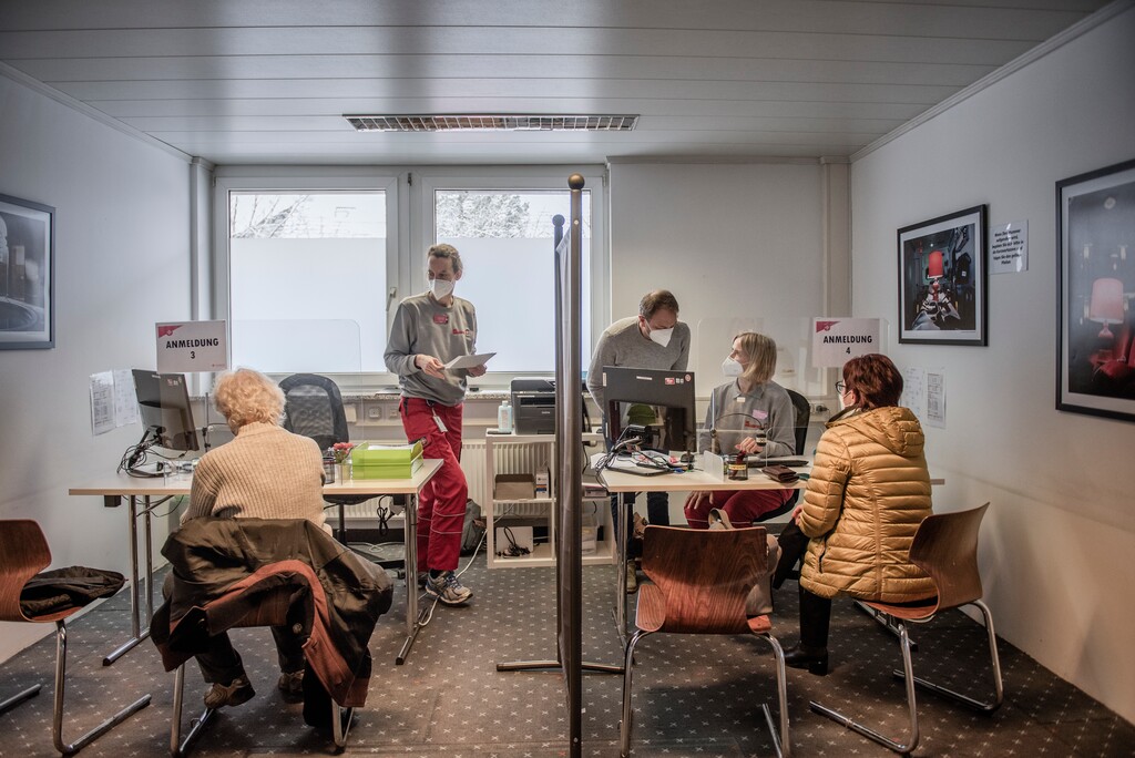 (Laetitia Vancon | The New York Times) 

Two women register to receive their COVID-19 vaccines at the Johanniter Unfall Hilfe in Munich, Germany, March 18, 2021.