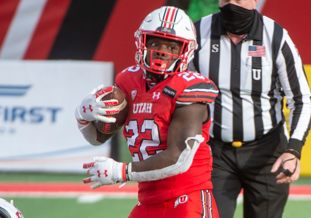 (Rick Egan | The Salt Lake Tribune) Utah  running back Ty Jordan (22) runs the ball for the Utes, in PAC-12 football acton between Utah Utes and Washington State Cougars at Rice-Eccles Stadium on Saturday, Dec. 19, 2020.