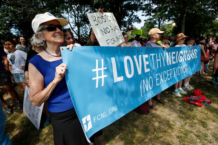 Counterprotesters holds signs at a "Free Speech" rally by conservative activists on Boston Common, Saturday, Aug. 19, 2017, in Boston. Thousands of counterprotesters marched through downtown Boston on Saturday, chanting anti-Nazi slogans and waving signs condemning white nationalism ahead of a rally being staged by conservative activists a week after a Virginia demonstration turned deadly.  (AP Photo/Michael Dwyer)