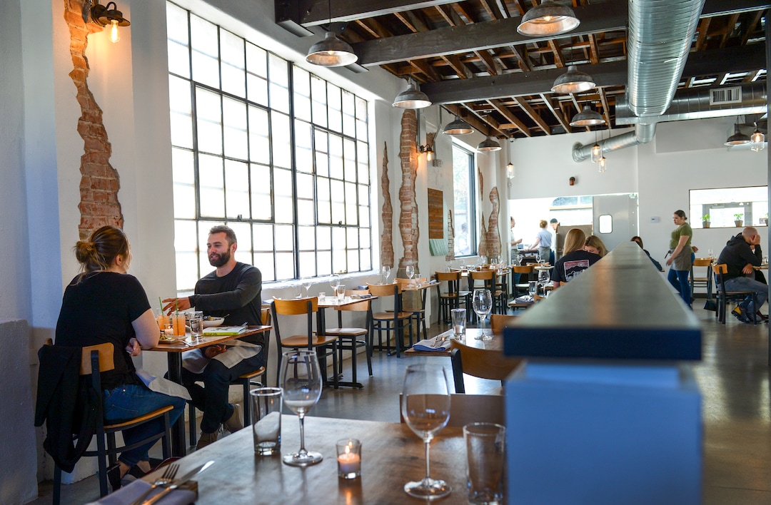 Leah Hogsten  |  The Salt Lake Tribune  l-r Sasha Panasiuk and David Marquardt dine at SLC Eatery, Friday, May 3, 2019. SLC Eatery's regular menu and the cart offerings include globally inspired flavors of Latin America, the Mediterranean and Asia.
