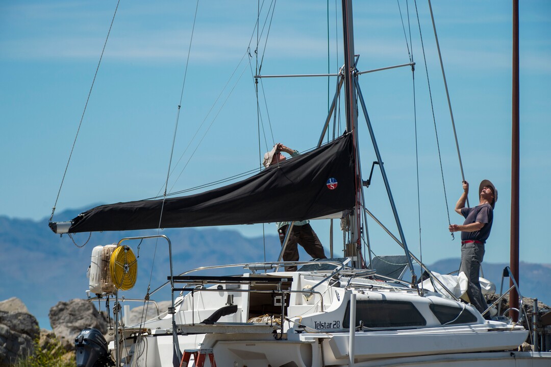 (Rick Egan  |  The Salt Lake Tribune)     Rick Hoffman and Greg Wilson work on a boat at the Great Salt Lake Marina,Tuesday, June 11, 2019.