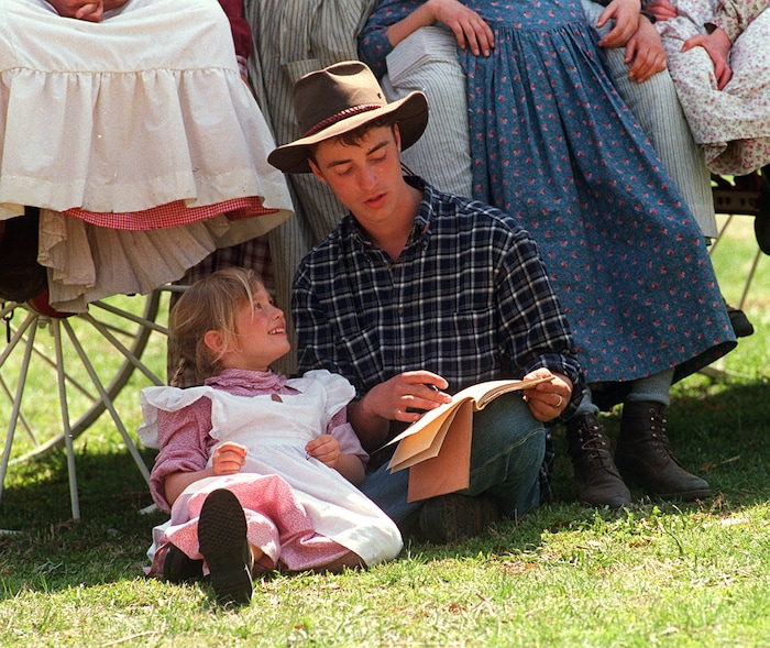 Rick Egan  | Tribune File Photo 

Nathan Anderson, 18, reads to Sarah Dicken, 5 in Florence, Nebraska.  