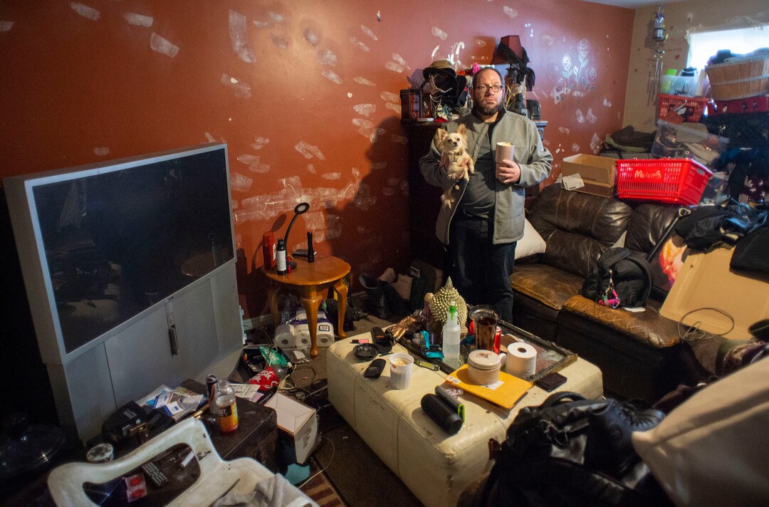 (Rick Egan | The Salt Lake Tribune)   James Morrill, holds his dog Izzy, and he tries to figure out where he will go, and what he will do with all of his possessions, because he only has 3 more hours before the police will come in and clear everyone out of the Georgia apartments.  Saturday, Feb. 16. 2019