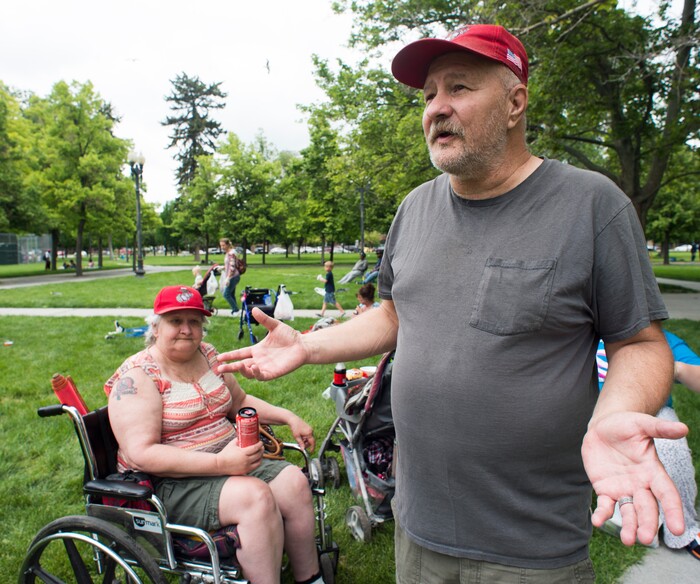 (Rick Egan  |  The Salt Lake Tribune)      
Sugar House residents, Janice and Derek Mullins, talk about how they met three years ago this weekend, when they were both homeless. They returned to Pioneer park to visit friends, as the Salt Lake City Mission fed and donated clothes to the homeless in Pioneer Park on Memorial day, Monday, May 28, 2018.



