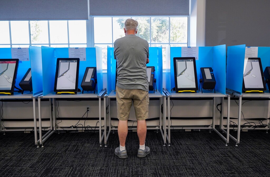 (Chris Samuels | The Salt Lake Tribune) Lynn Lewis votes at Riverton City Hall on Tuesday, Aug. 12, 2025.