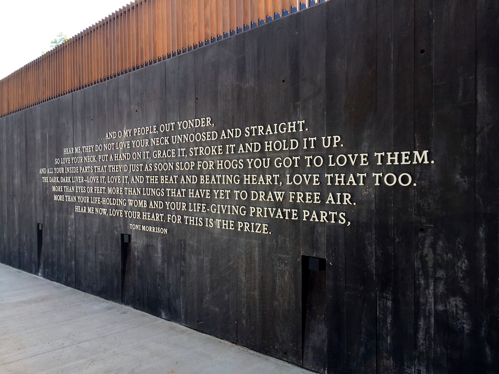 This April 28, 2018 photo shows a poem by Toni Morrison inscribed on a wall at the new National Memorial for Peace and Justice in Montgomery, Ala. The memorial documents more than 4,400 racial terror lynchings that took place between 1877 and 1950, but the grounds of the 6-acre site also include sculptures and places for reflection. The poem ends with the words, "Love your heart, for this is the prize." (AP Photo/Beth J. Harpaz)