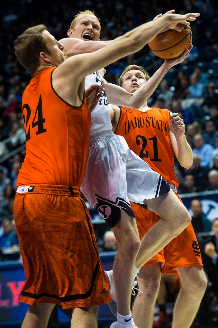 (Chris Detrick  |  The Salt Lake Tribune)  Brigham Young Cougars guard TJ Haws (30) shoots past Idaho State Bengals forward Blake Truman (24) and Idaho State Bengals guard Jared Stutzman (21) during the game at the Marriott Center Thursday, December 21, 2017.  
