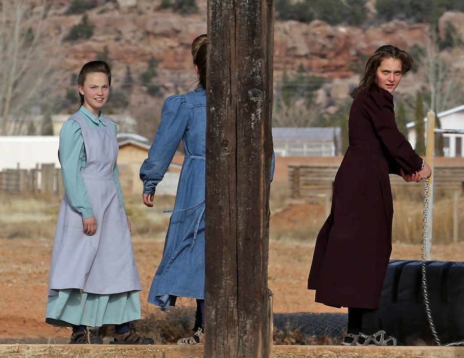 (Rick Bowmer AP)  In this Dec. 16, 2014 photo, girls stand in a playground in Colorado City, Ariz.