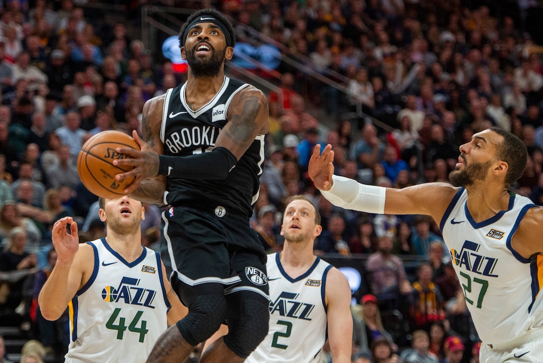(Rick Egan  |  The Salt Lake Tribune)        Brooklyn Nets guard Kyrie Irving (11) takes the ball to the hoop for a layup, in NBA basketball action between the Utah Jazz and the Brooklyn Nets in Salt Lake City, Tuesday, Nov 12, 2019.