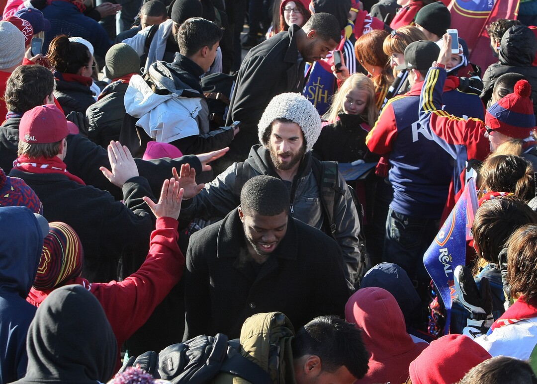 Scott Sommerdorf   |  The Salt Lake TribuneRSL fans give midfielder Kyle Beckerman high fives as he and other Real Salt Lake players and coaches as they make their way through a sea of fans after arriving in Salt Lake at the TAC Air sports terminal, Sunday December 8, 2013.