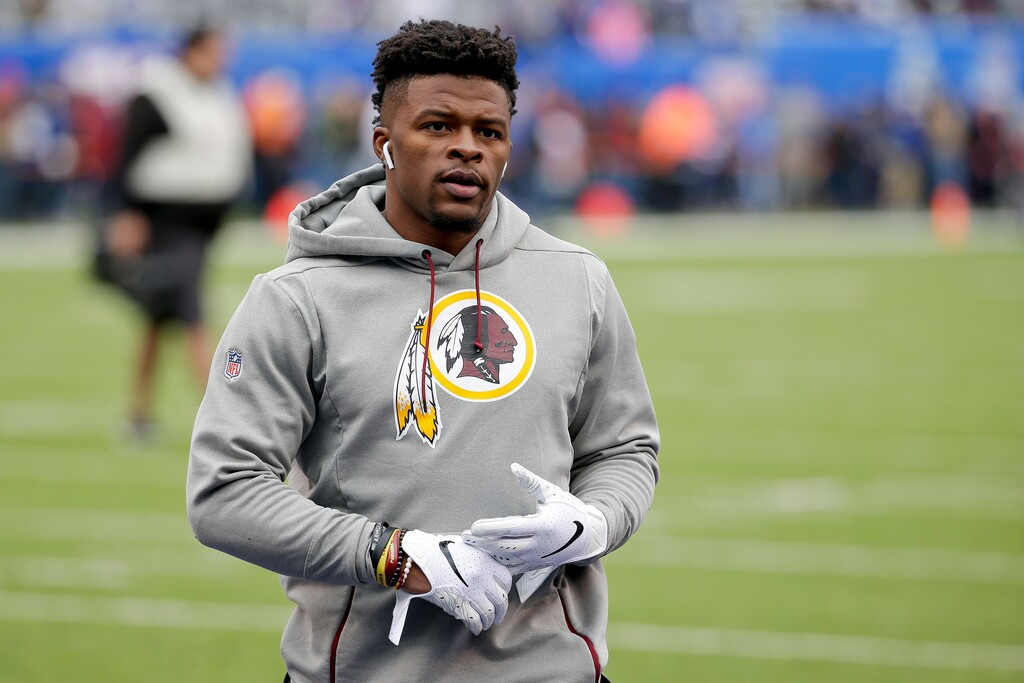 FILE - In this Oct. 28, 2018, file photo, then-Washington running back Chris Thompson (25) warms up before an NFL football game against the New York Giants in East Rutherford, N.J. Reporters from The Associated Press spoke to more than two dozen athletes from around the globe -- representing seven countries and 11 sports -- to get a sense of how concerned or confident they are about resuming competition. Thompson is an NFL running back. He’s also the father of a 4-month-old daughter, Kali. “If I go practice or play and I come back home with the virus, she’s not strong enough yet to fight something like that. For me, that’s my biggest worry,” said Thompson, who signed with the Jacksonville Jaguars this month after seven seasons with the Redskins. (AP Photo/Seth Wenig, File)