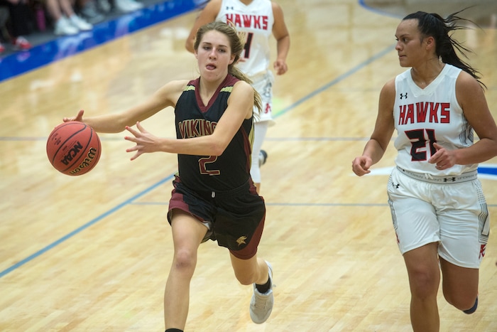 (Chris Detrick | The Salt Lake Tribune) Viewmont's Emma Carr (2) runs past Alta's Eden Broederlow (21) during the game at Pleasant Grove High School Thursday, November 30, 2017. Viewmont defeated Alta 65-44.