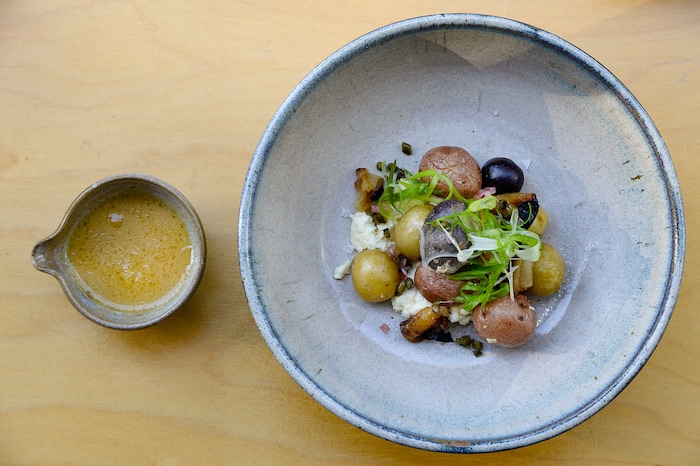 (Francisco Kjolseth  |  The Salt Lake Tribune)  The milk braised heirloom potatoes, curds whey vinaigrette and alliums at Oquirrh, a new fine-dining restaurant in downtown Salt Lake City at 368 E. 100 South.