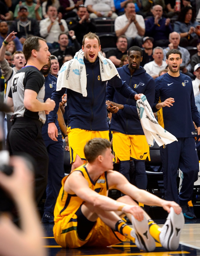 (Steve Griffin  |  The Salt Lake Tribune) The Jazz bench jumps to their feet as Utah Jazz forward Jonas Jerebko (8) sits on the court after making a shot and being fouled during the Utah Jazz versus Detroit Pistons at Vivint Smart Home Arena in Salt Lake City Tuesday March 13, 2018.