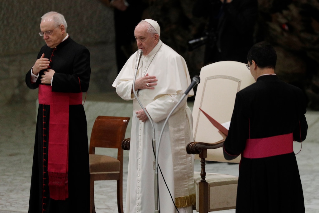 Pope Francis, center, makes the sign of the cross during his weekly general audience in the Paul VI hall at the Vatican, Wednesday, Oct. 21, 2020. Pope Francis endorsed same-sex civil unions for the first time as pope while being interviewed for the feature-length documentary “Francesco,” which premiered Wednesday at the Rome Film Festival. (AP Photo/Gregorio Borgia)