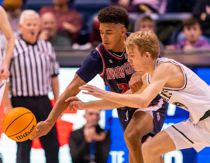 (Rick Egan | The Salt Lake Tribune) 
Woods Cross, forward, Mason Bendinger (24) goes for a loose ball Olympus forward, Lucas Mckane (22), in the 5A State Championship game between Woods Cross and Olympus, at the Marriott Center in Provo, on Saturday, March 5, 2022. 