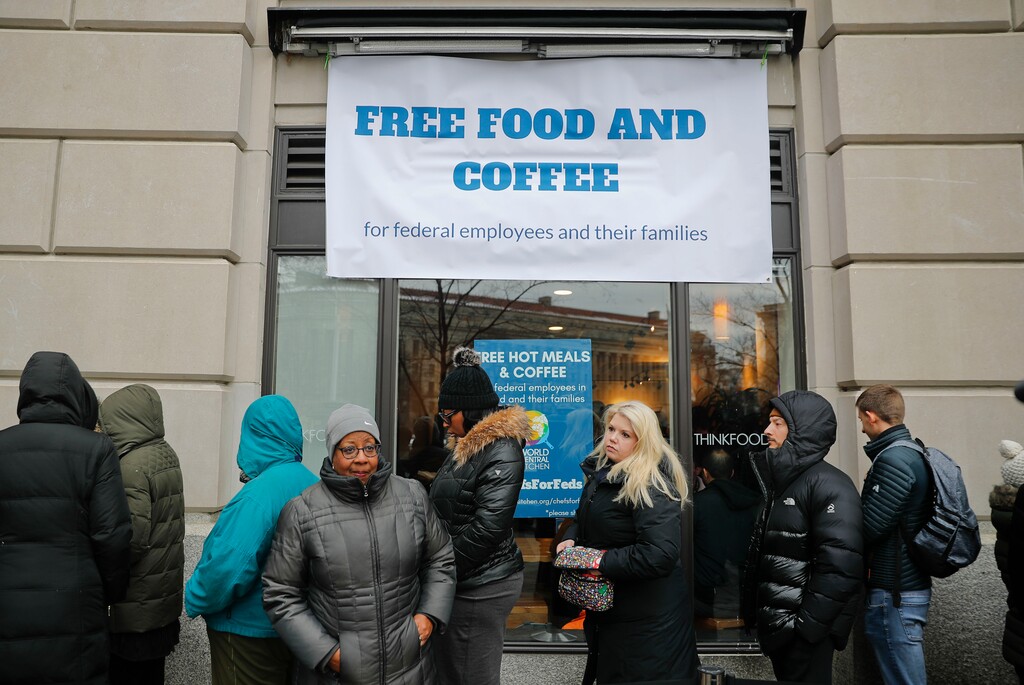(Pablo Martinez Monsivais  |  AP Photo)  People wait in line at Chef Jose Andres' World Central Kitchen for free meals to workers effected by the government shutdown, Wednesday, Jan. 16, 2019 in Washington. Andres opened his World Central Kitchen feeding site on Pennsylvania Ave., to provide food to furloughed workers and their families.