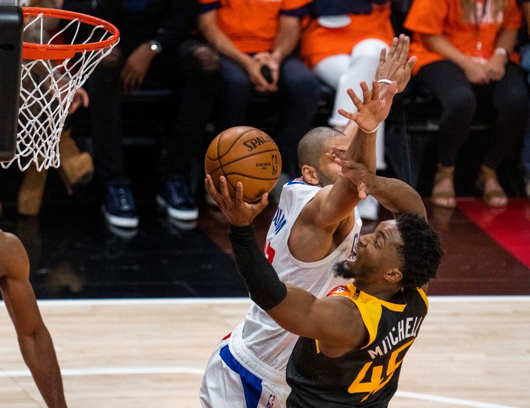 (Rick Egan | The Salt Lake Tribune) Utah  guard Donovan Mitchell (45) shoots as LA Clippers forward Nicolas Batum (33) defends, in second round playoff action in game 2 between the Utah Jazz and the LA Clippers, at Vivint Arena, on Thursday, June 10, 2021.