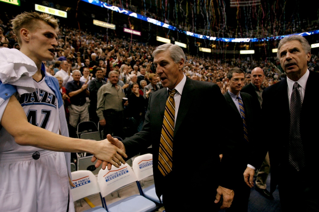 (Rick Egan  |  Tribune file photo) Jerry Sloanshakes hands with Andrei Kirilenko after getting his 1000th win as a coach on Dec. 11, 2008.