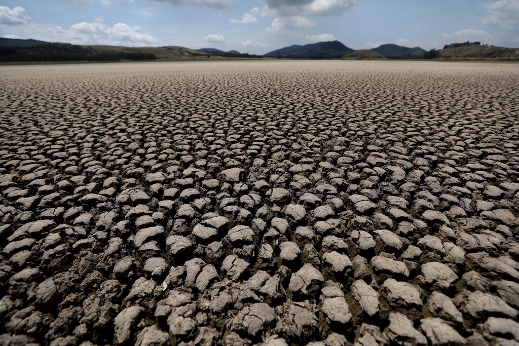 (Fernando Vergara | AP photo)
After years of very little rainfall, the lakebed of Suesca lagoon sits dry and cracked, in Suesca, Colombia, Wednesday, Feb. 17, 2021. The basin which is dependent on runoff has suffered severe deforestation and erosion, which together with the added impact of climate change has led to a significant reduction of its water level.