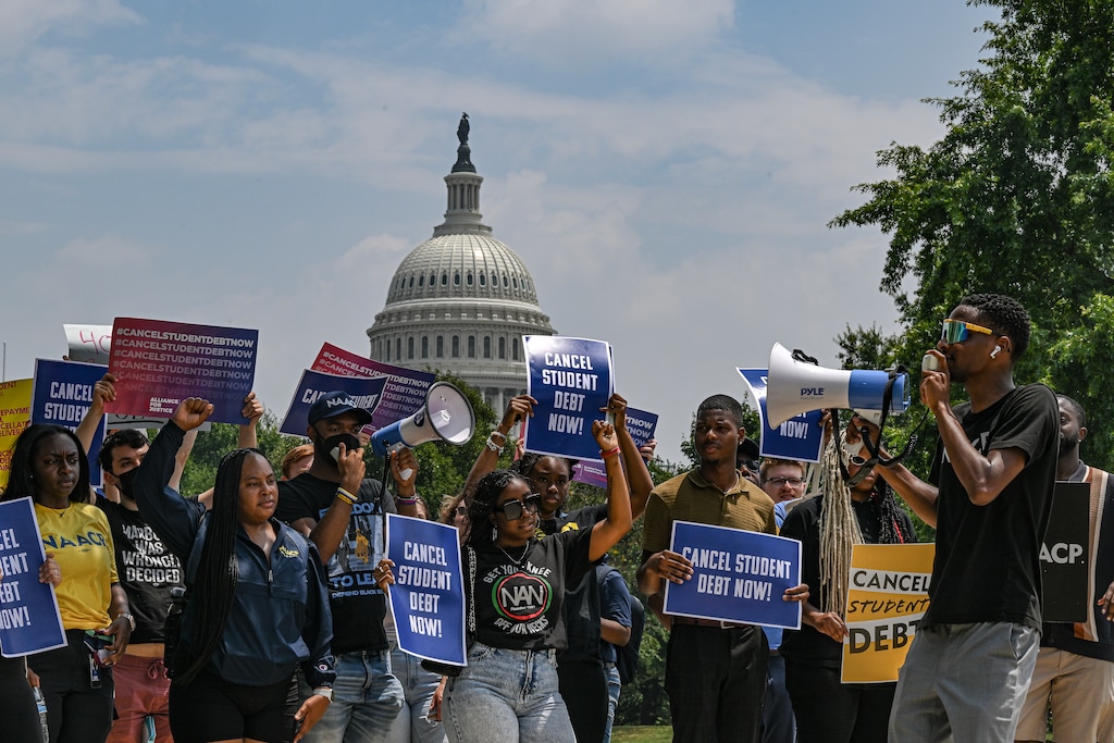 (Kenny Holston | The New York Times) Demonstrators calling for the cancellation of student debt, in Washington, June 30, 2023. More than 800,000 borrowers will have $39 billion in federal student loan debt eliminated under a government effort to remedy years of mistakes by the loan servicers.
