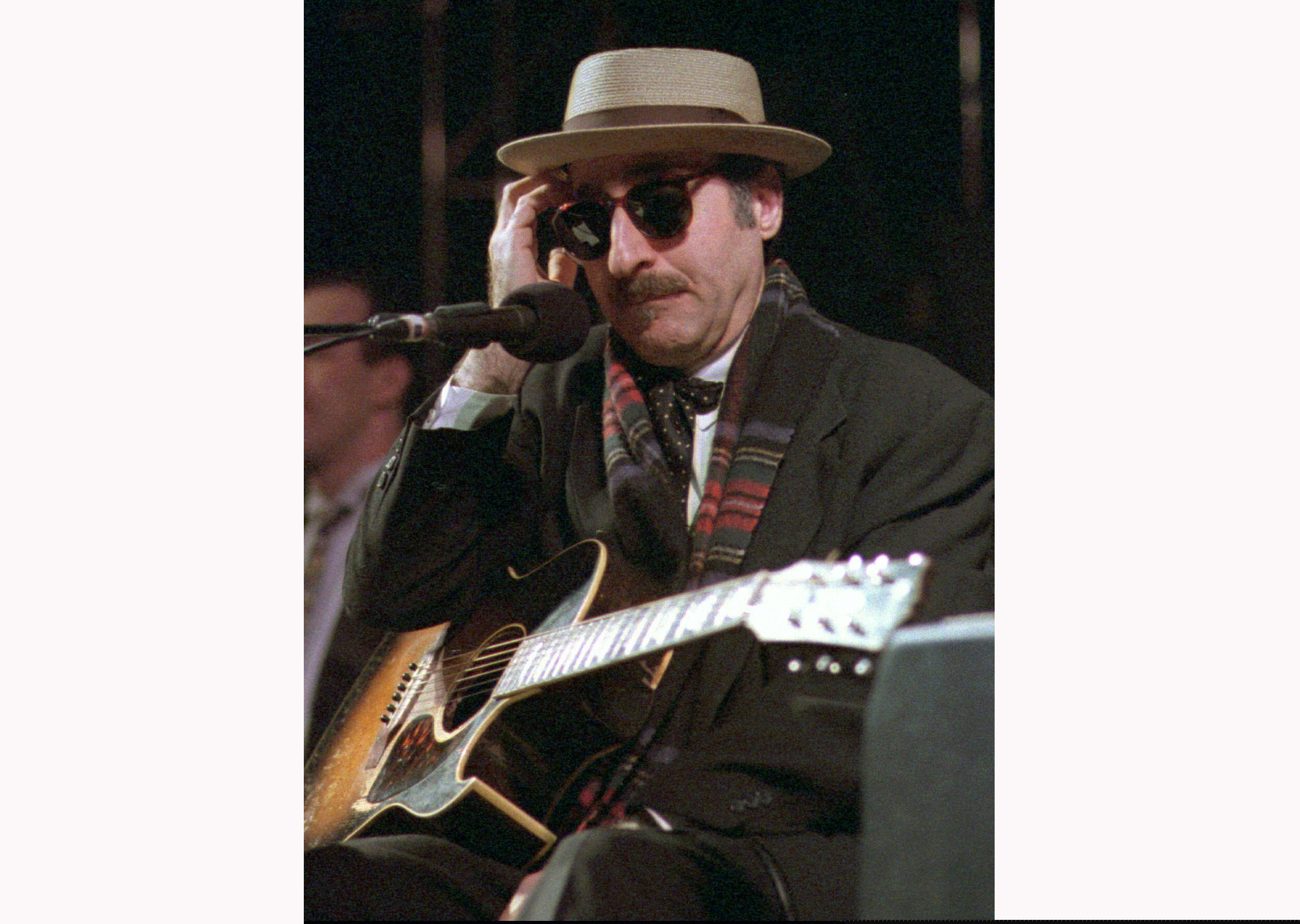 (Patricia Wilson/The Times-Standard via AP file) Leon Redbone performs at the eighth annual Redwood Coast Dixieland Jazz Festival in Eureka, Calif., on March 28, 1998. Redbone, the acclaimed singer and guitarist who performed jazz, ragtime and Tin Pan Alley-styled songs, died Thursday, May 30, 2019, according to a statement released by his family. No details about his death were provided.