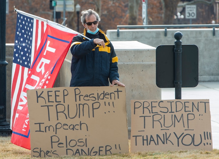 (Rick Egan | The Salt Lake Tribune)  A lone Trump supporter stands on the lawn at the state Capitol where police and the National Guard were out in force, on Sunday, Jan. 17, 2021.