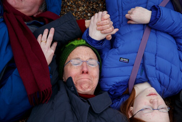 Demonstrators participate in a "lie-in" during a protest in favor of gun control reform in front of the White House, Monday, Feb. 19, 2018, in Washington. (AP Photo/Evan Vucci)