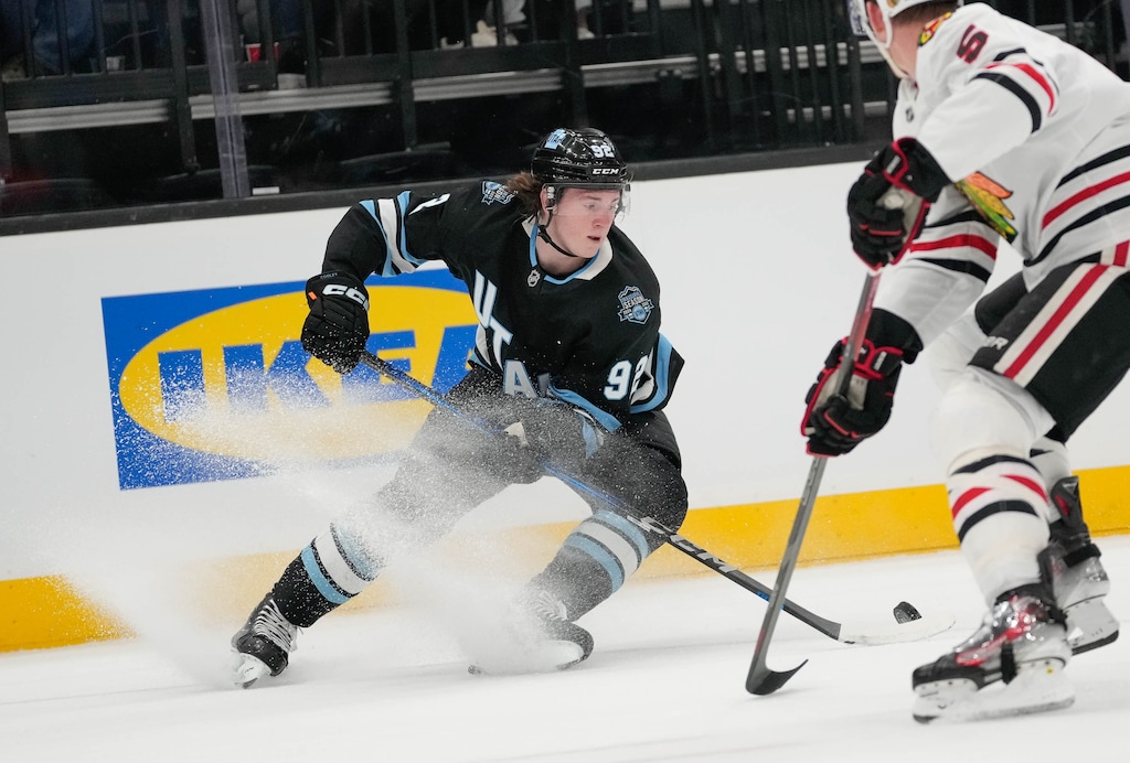 (Francisco Kjolseth | The Salt Lake Tribune) Utah Hockey Club center Logan Cooley (92) goes up against Chicago Blackhawks defenseman Connor Murphy (5) during an NHL hockey game at the Delta Center in Salt Lake City on Feb. 25. The Blackhawks beat Utah 4-3 in overtime on Friday night in Chicago.