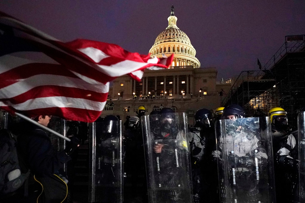(Julio Cortez | AP photo)
 
Police stand guard after a day of riots at the U.S. Capitol in Washington on Wednesday, Jan. 6, 2021.
