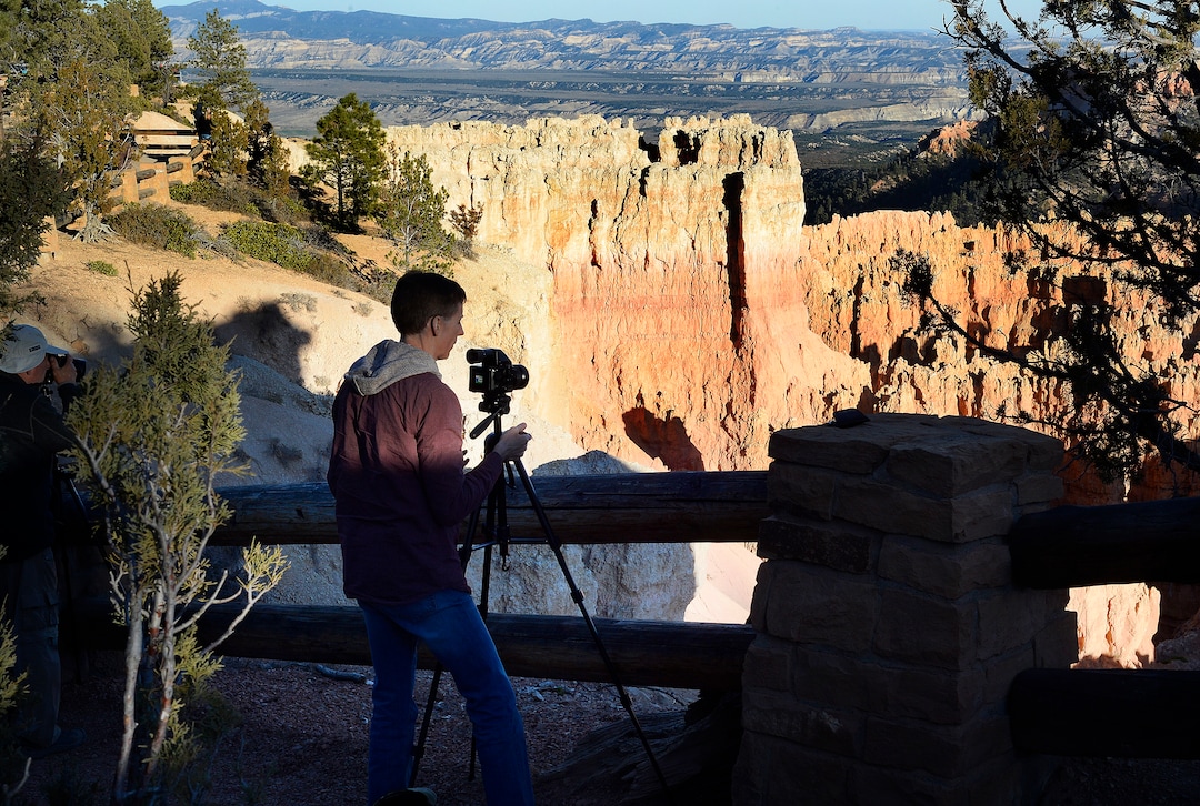 (Scott Sommerdorf   |  The Salt Lake Tribune)  A young man makes photos at "Sunset Point" in Bryce Canyon National Park on Saturday, October 14, 2017. 