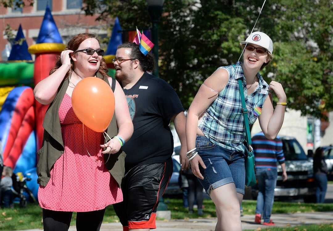 (Scott Sommerdorf   |  The Salt Lake Tribune)   Amanda Mehner, left, Michael Mehner, and Naomi Tuft, right, dance at the fifth annual Provo Pride Festival, Saturday, September 16, 2017.