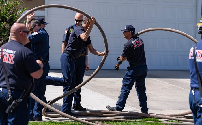 (Francisco Kjolseth | The Salt Lake Tribune) South Jordan firefighters prepare for a planned burn of a basement portion of a home where an owner kept a stockpile of explosives on Tuesday, June 1, 2021.