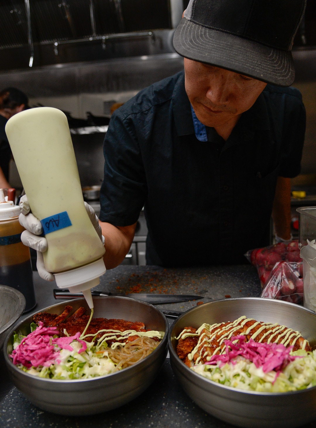 (Francisco Kjolseth  |  The Salt Lake Tribune)  Sous chef Young-Ho Kan prepares a Chicken Katsu with pancro crusted fried chicken served with house katsu sauce and avocado/cilantro aioli at the Angry Korean fusion restaurant. Originally started with a food truck, they now have a sit-down restaurant in South Jordan.