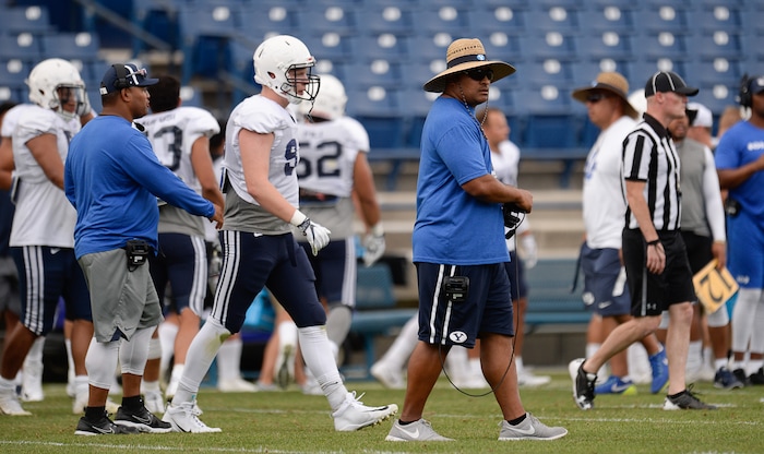 (Francisco Kjolseth  |  The Salt Lake Tribune)  BYU head coach Kalani Sitake keeps an eye on the game as they hold a scrimmage at LaVell Edwards Stadium in Provo on Thursday, Aug. 10, 2017.