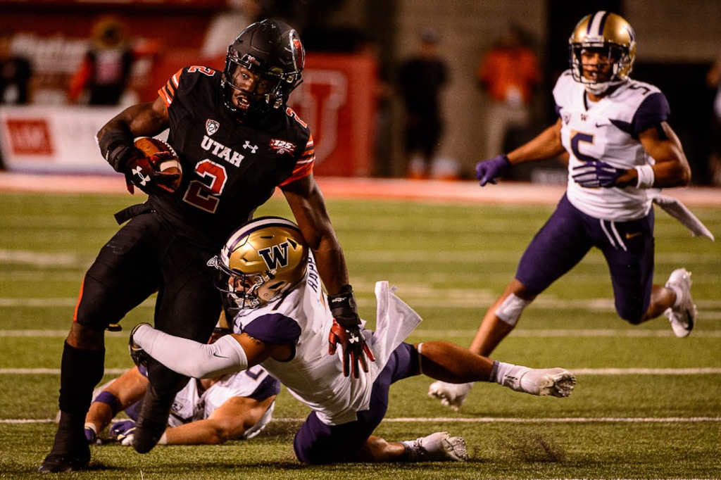 (Trent Nelson | The Salt Lake Tribune)  Utah Utes running back Zack Moss (2) runs the ball as the University of Utah hosts Washington at Rice-Eccles Stadium in Salt Lake City, Saturday Sept. 15, 2018.