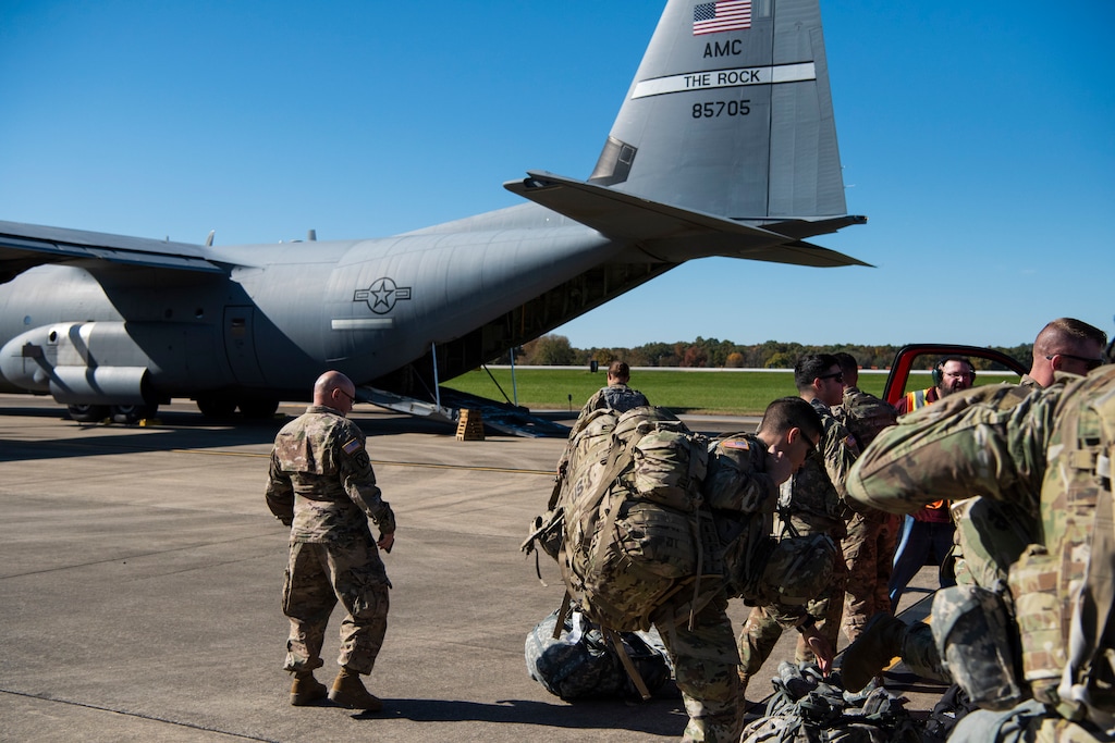 (Airman 1st Class Zoe M. Wockenfuss | U.S. Air Force | The Associated Press) This Oct. 29, 2018 photo provided by the U.S. Air Force shows deployers from Headquarters Company, 89th Military Police Brigade, Task Force Griffin get ready to board a C-130J Super Hercules from Little Rock, Arkansas, at Fort Knox, Kentucky, in support of Operation Faithful Patriot. The Trump administration on Monday, Oct. 29, 2018, announced plans to deploy 5,200 active duty troops, double the 2,000 who are in Syria fighting the Islamic State group, to the border to help stave off the caravans. The main caravan, still in southern Mexico, was continuing to melt away, from the original 7,000 to about 4,000, as a smaller group apparently hoped to join it.