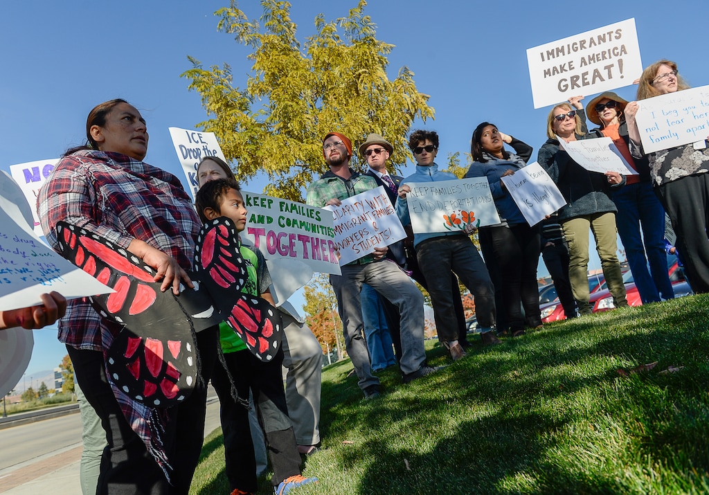 (Francisco Kjolseth | The Salt Lake Tribune) Community members rally in front of the Immigration and Customs Enforcement offices in West Valley City on Monday, Oct. 16, 2017, to support Maria Santiago Garcia, at left, a single Utah mother of four U.S. born children who faces an impending deportation order.