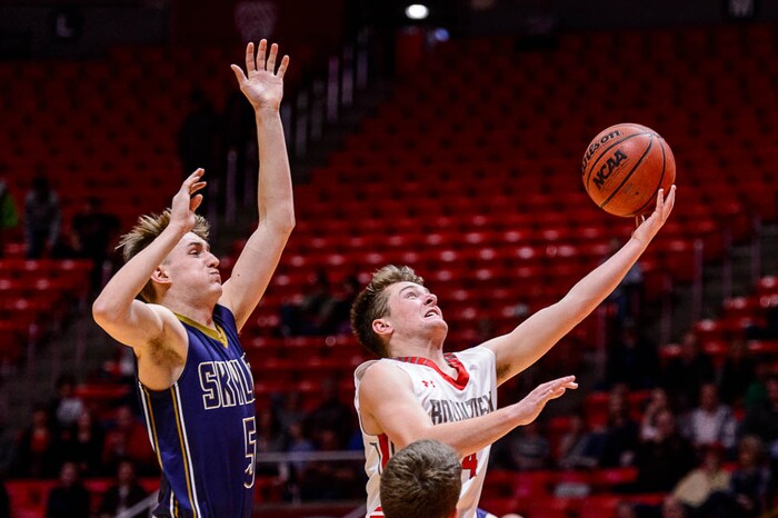 (Trent Nelson | The Salt Lake Tribune)  Skyline vs. Bountiful, 5A State high school basketball tournament at the Huntsman Center in Salt Lake City, Wednesday Feb. 28, 2018. Bountiful's David Stevenson (4) shoots ahead of Skyline's Hollan Schweitz (5).