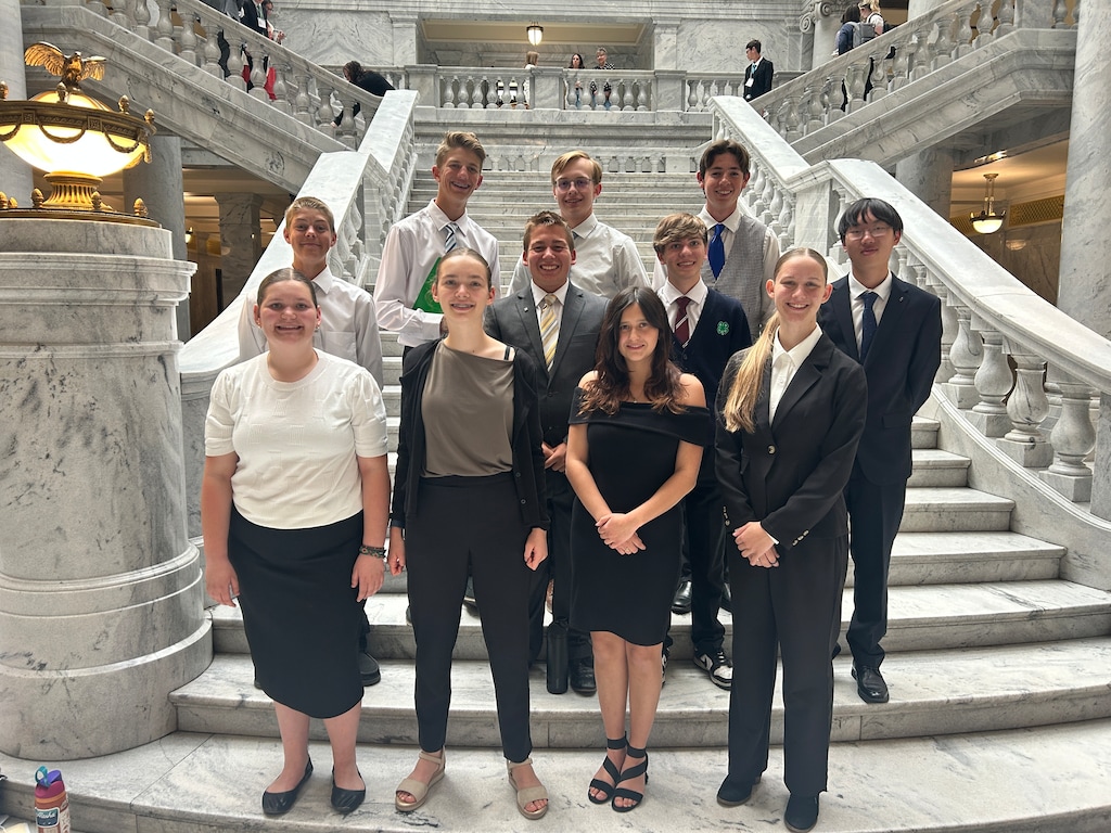 (Photo courtesy Katarina Aikens) Members of the Washington County 4-H Mock Legislature at the Utah Capitol in 2025. The author, Jenna Perdue, is the first one on left on the front row.