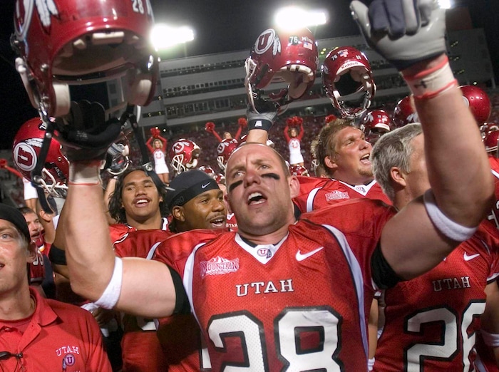(Trent Nelson  |  Tribune File Photo)  Steve Tate and the rest of the Utah football team sing the school song, "Utah Man" in a traditional postgame celebration after beating Arizona Friday September 2, 2005 at Rice-Eccles Stadium.